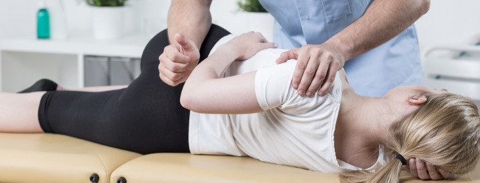 Woman getting a chiropractic adjustment